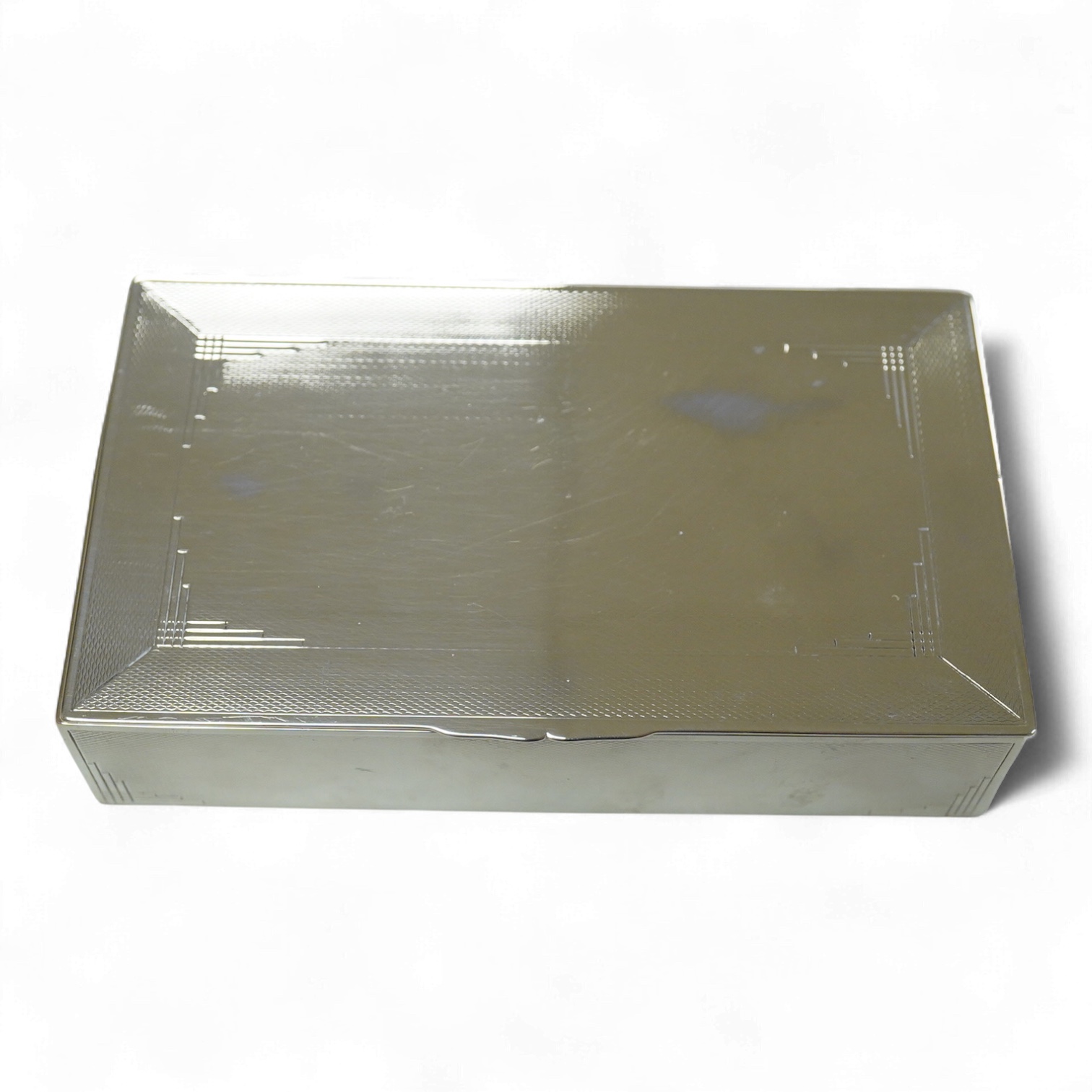 A George VI engine turned silver mounted rectangular cigarette box, by John Rose, Birmingham, 1936, 14.2cm.